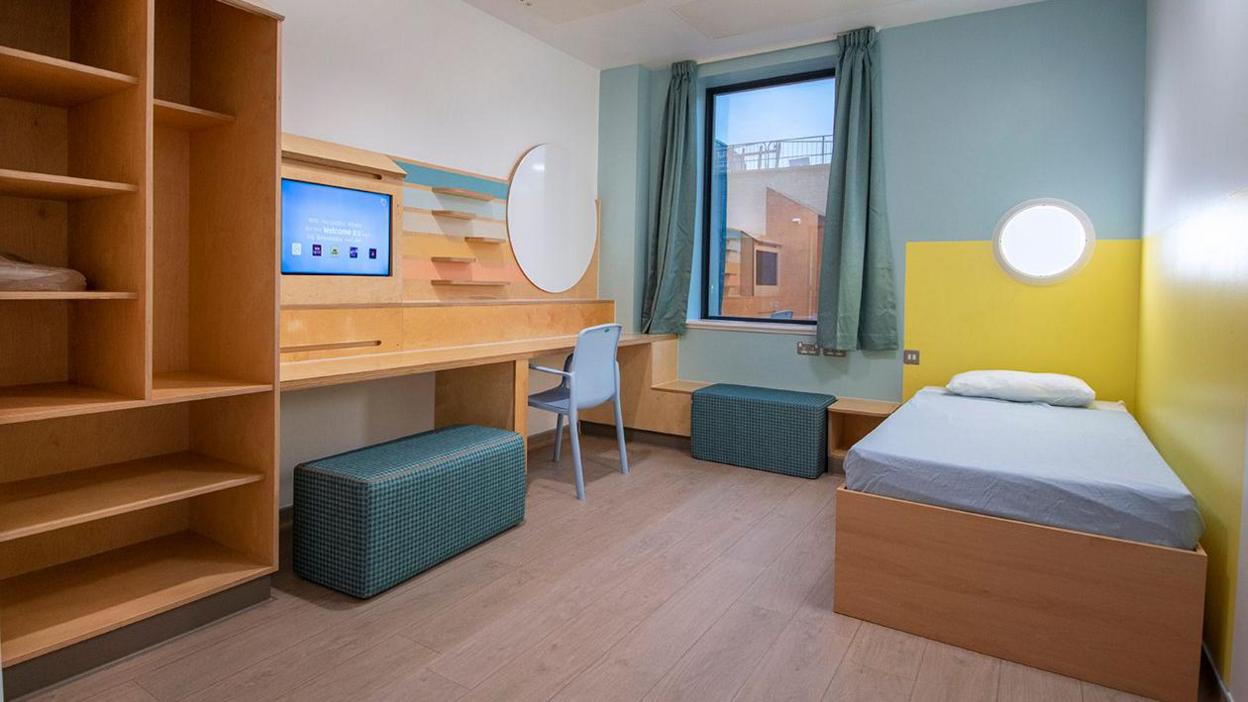 A colourful bedroom in the Melville Unit