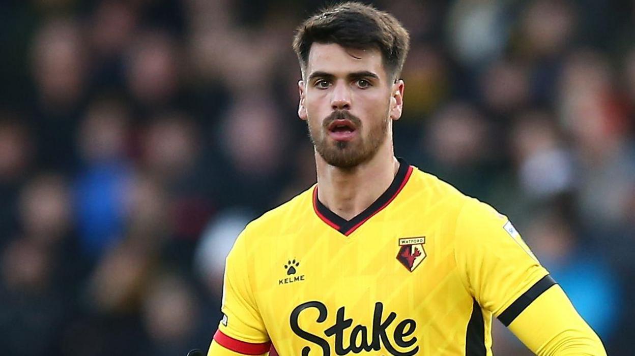 Joao Ferreira in his yellow Watford shirt in action during a game