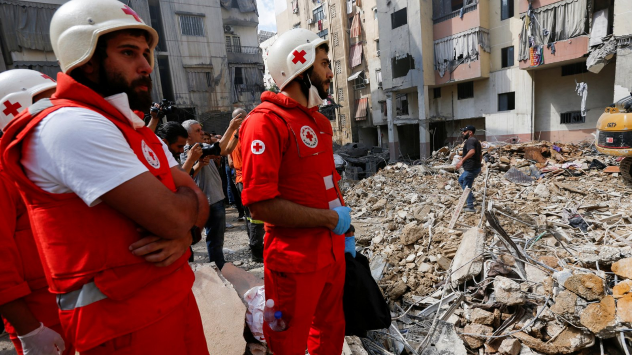 Medical personnel work at the site of Friday's Israeli strike, as search and rescue operations continued on Saturday