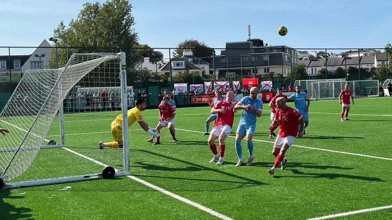 Action between Jersey Bulls and Hastings United