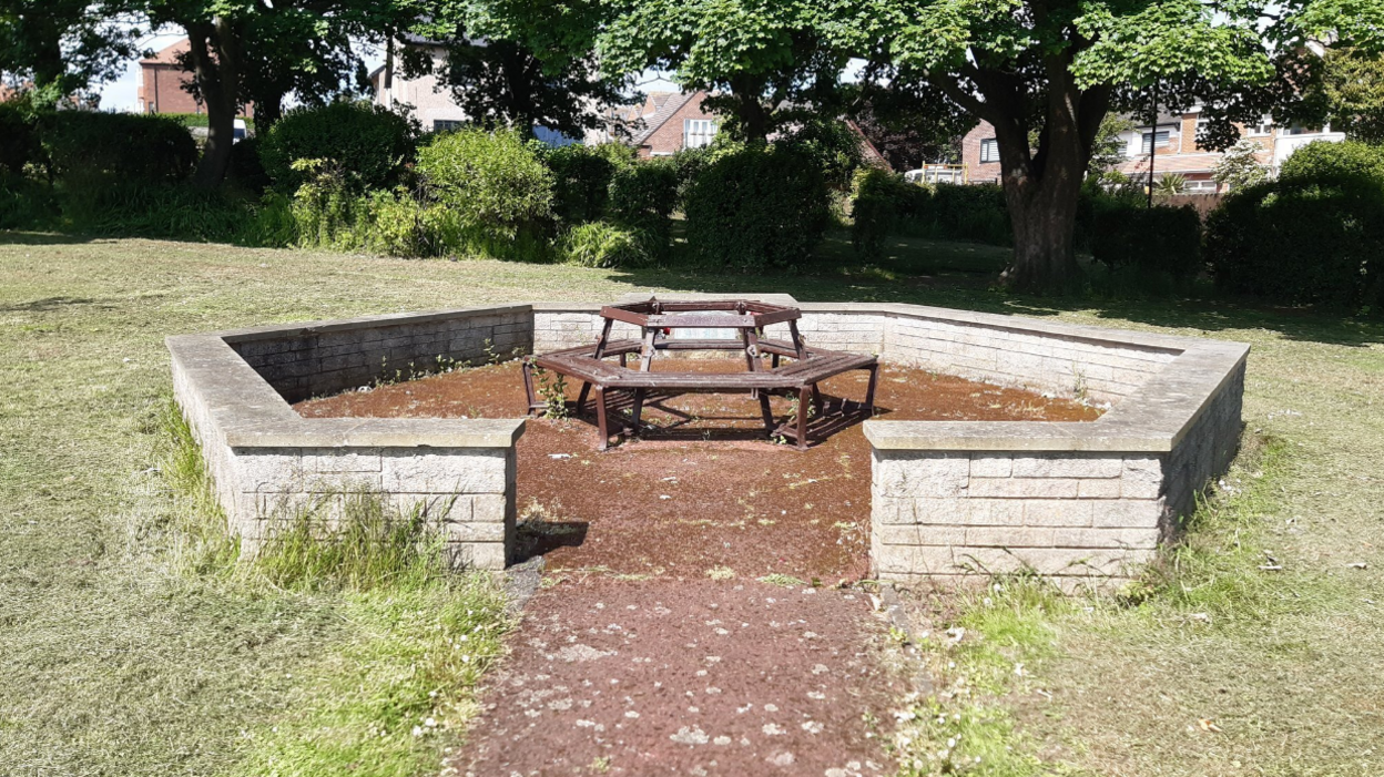 Fulwell War Memorial, a hexagonal wall with a bench at its centre