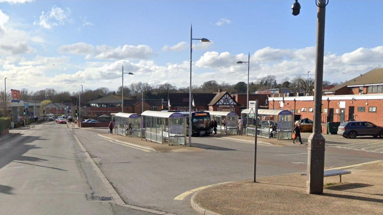 Town bus station with several ranks of bus stops