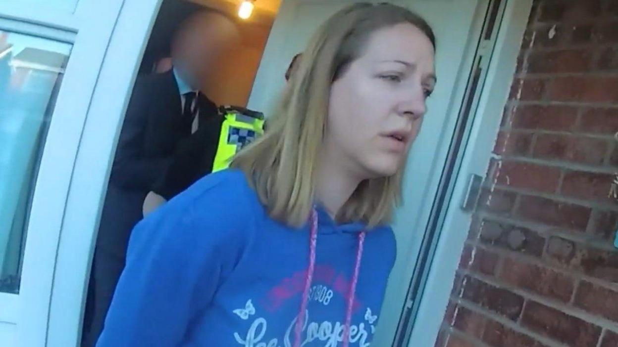 File screen grab taken from body worn camera footage issued by Cheshire Constabulary of the arrest of Lucy Letby