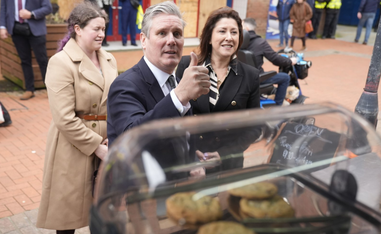 Labour Party leader Sir Keir Starmer talking to a person at a coffee stand during a campaign visit to Barrow-in-Furness, Cumbria