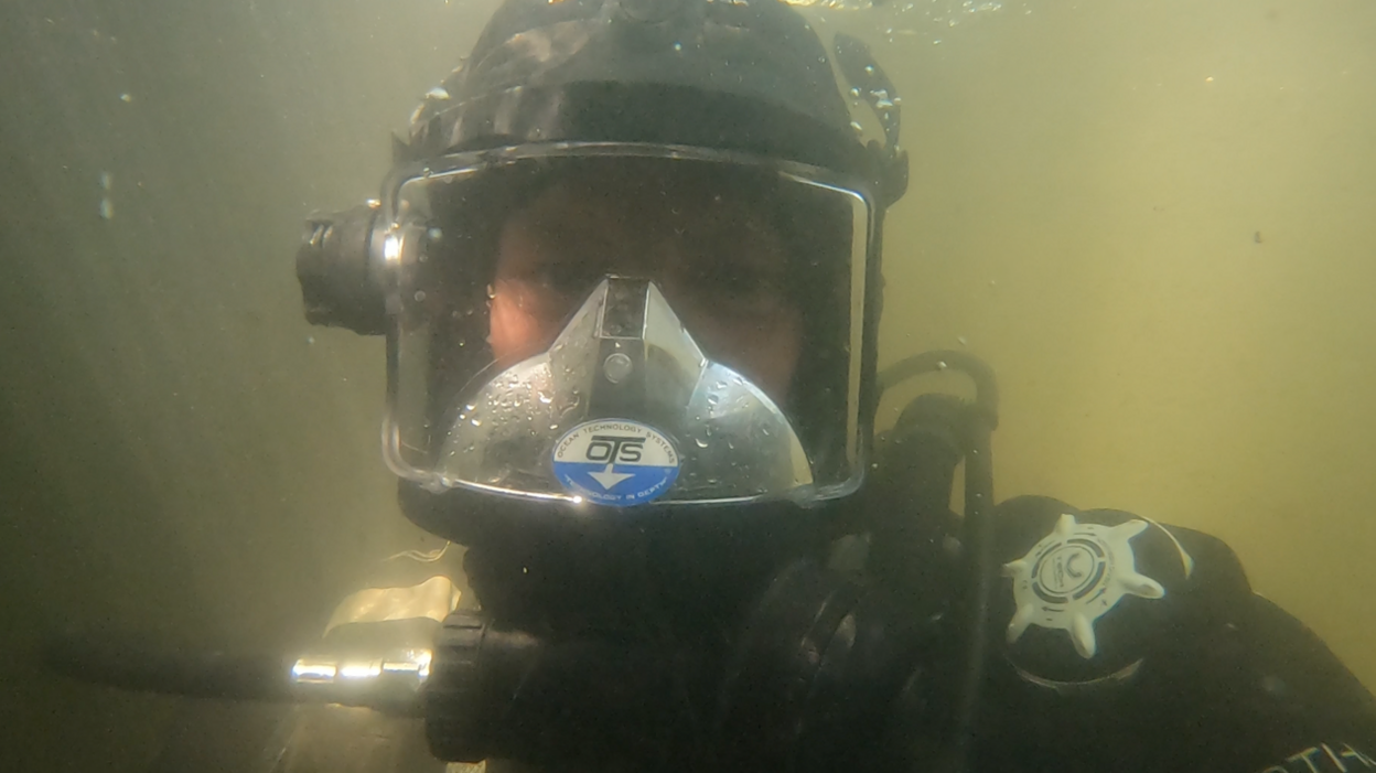 An underwater image of Gary Bankhead in full diving gear. 