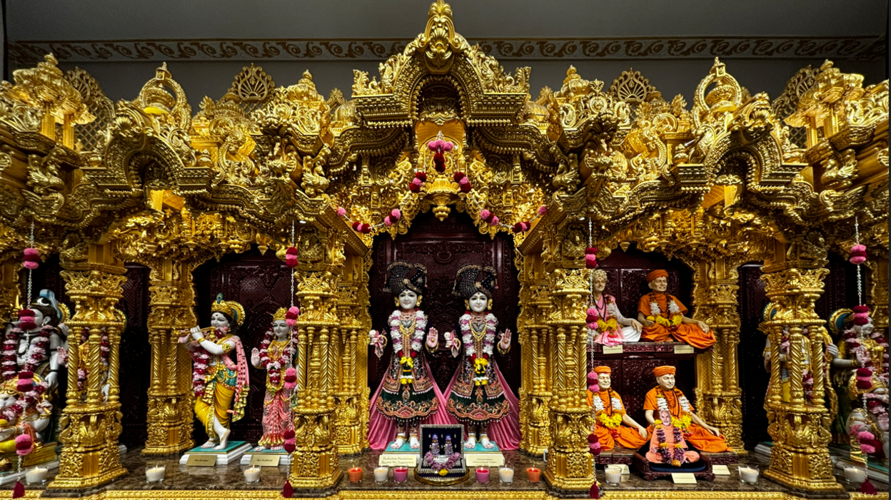 A gold shrine filled with Hindu deities