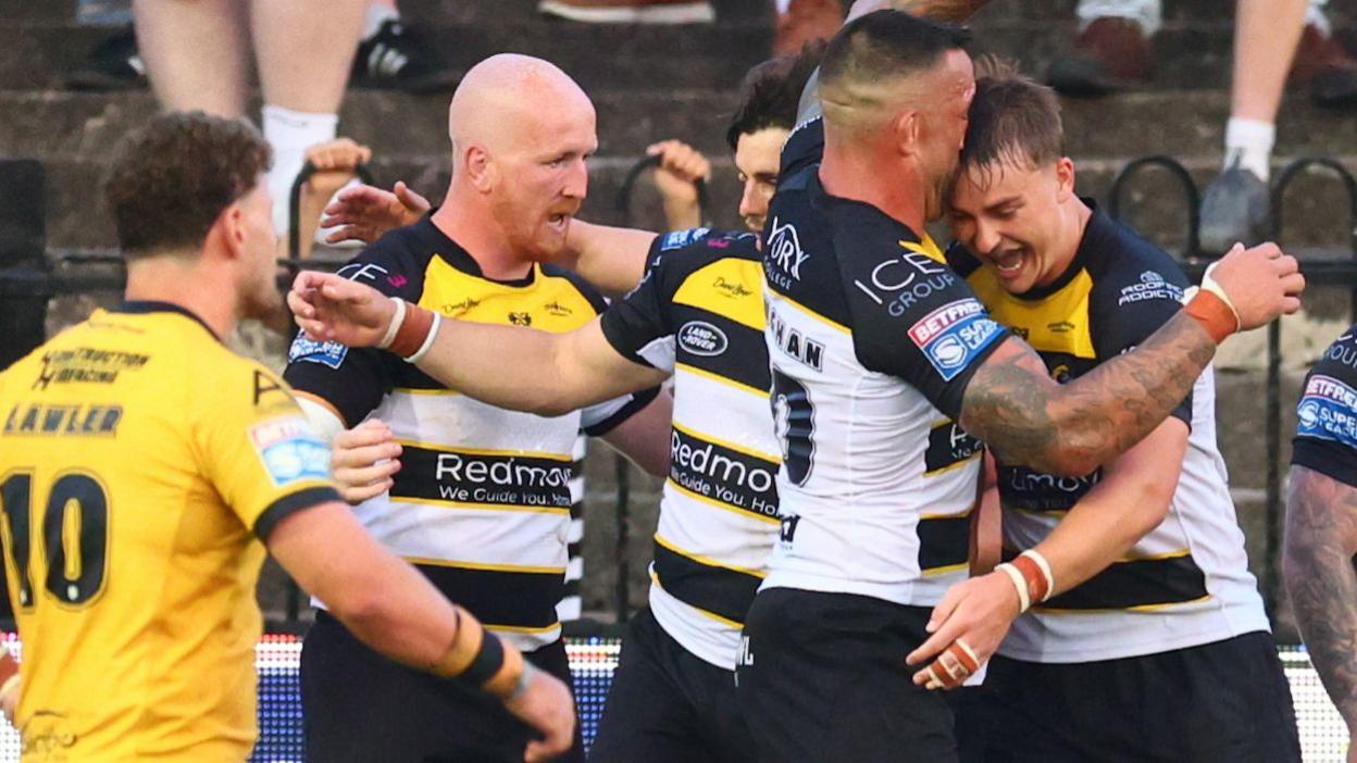 York Knights' Oli Field (right) celebrates scoring a try against Castleford Tigers with his team-mates