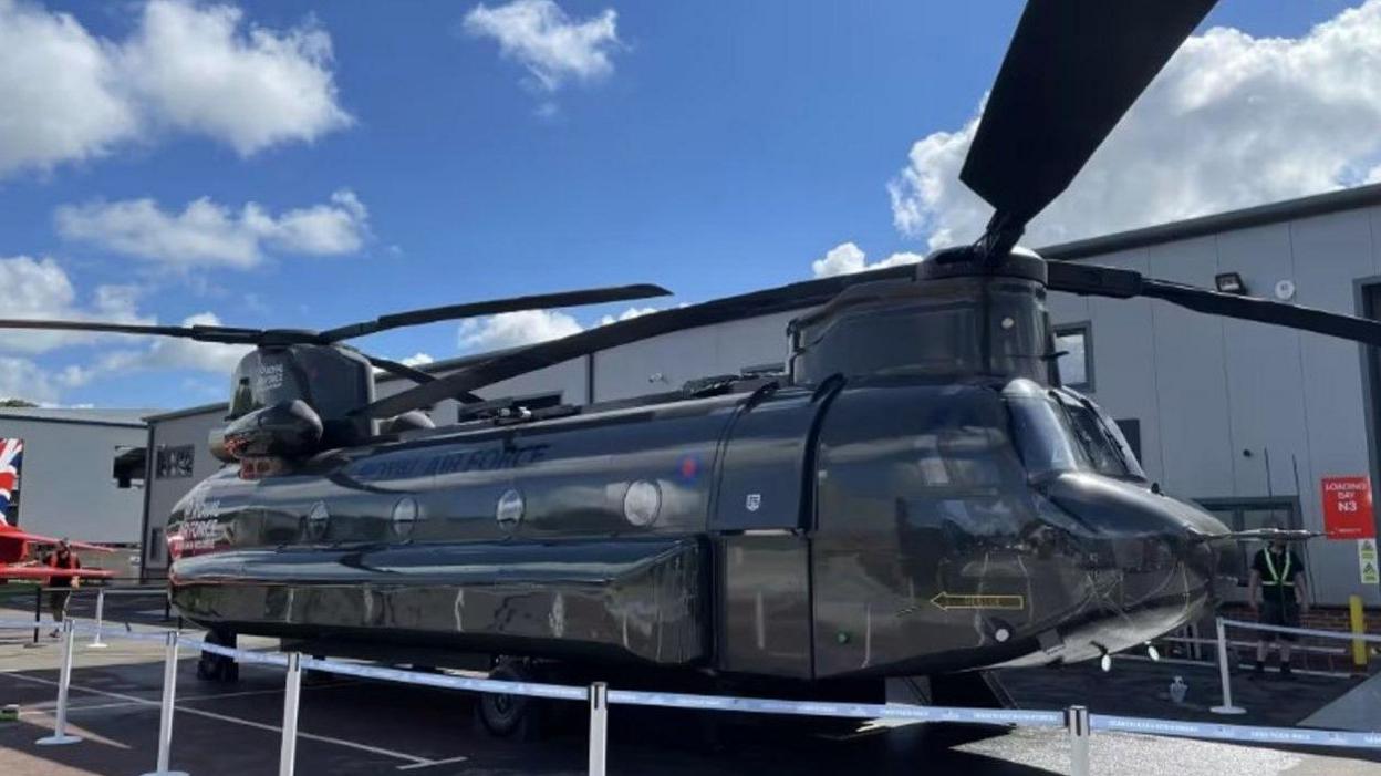 A static RAF chinook helicopter in RAF livery.