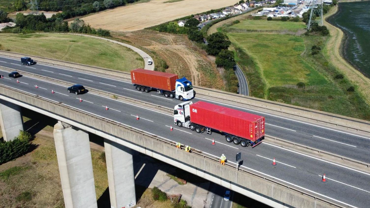 An aerial shot of the Orwell Bridge with vehicles travelling on it