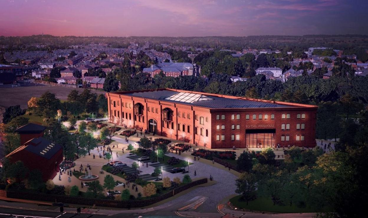 An artist's impression of how the Bonded Warehouse could look. The redbrick building is shown at night with a large glass skylight in the centre.

