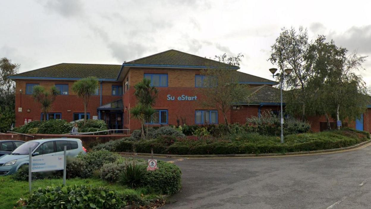 A children's centre under a grey sky. 