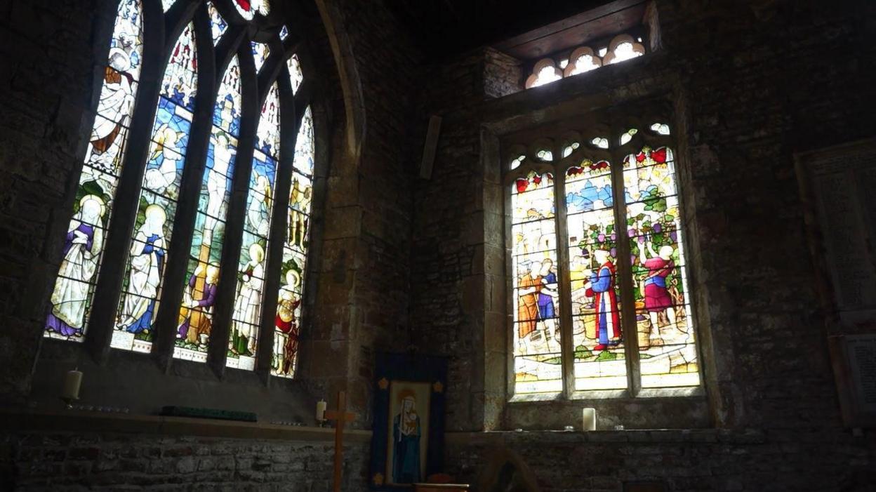 A stain glass inside the church depicting medieval times