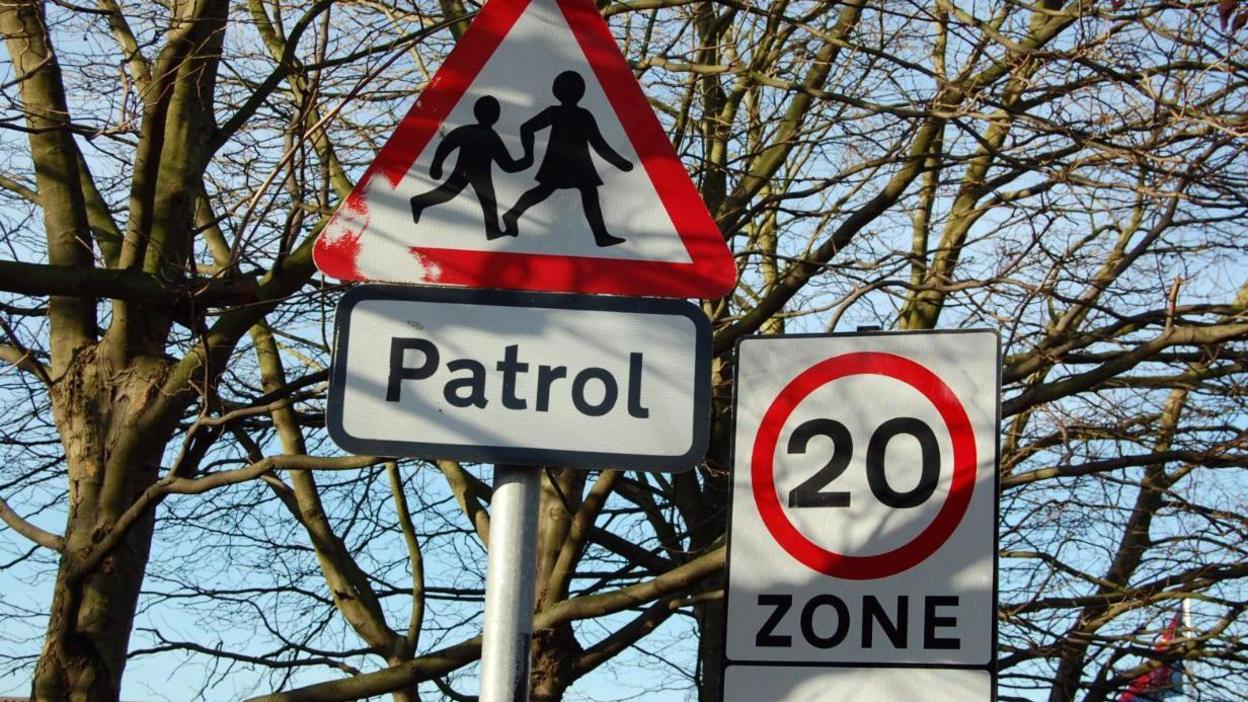 A school crossing patrol sign