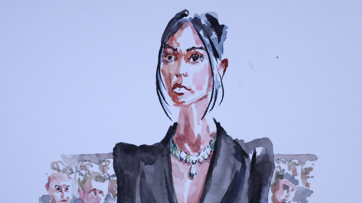 A water-colour-style court sketch of Kim Kardashian during the trial of 10 people accused of stealing millions of dollars worth of jewellery from her. She is seen wearing a black jacket and a sizeable diamond necklace.