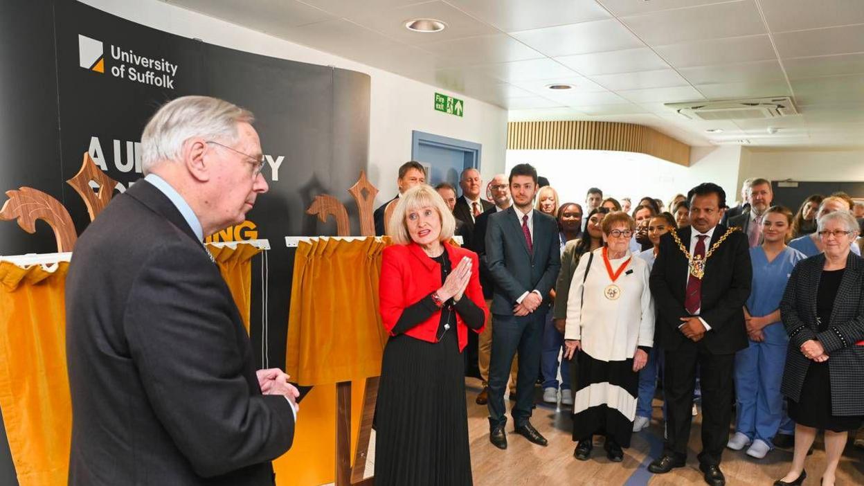 The Duke of Gloucester looks out toward staff and students of the new hub as Professor Jenny Higham talks.