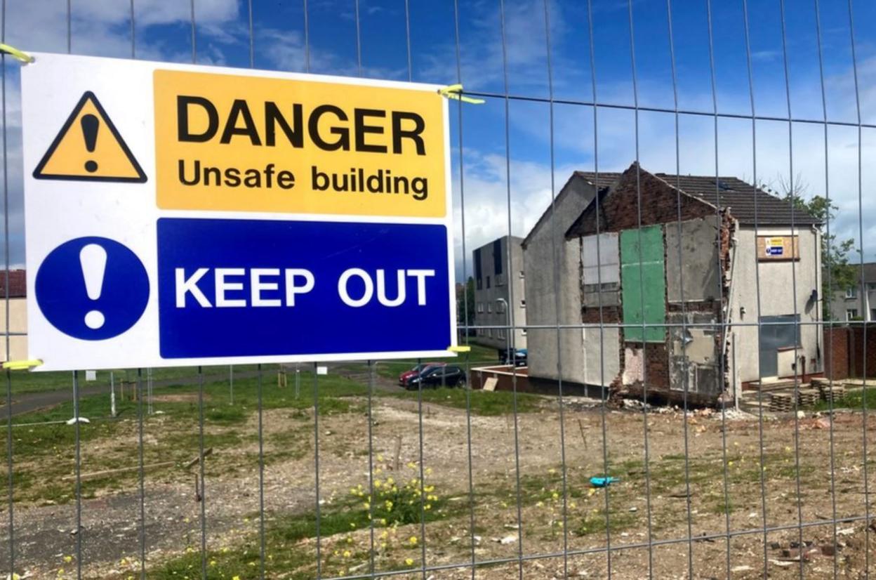 Site of explosion fenced off with one house still standing