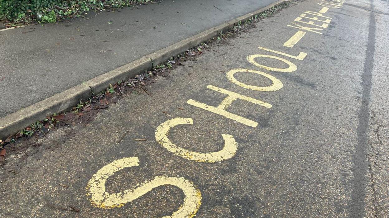 School sign on road