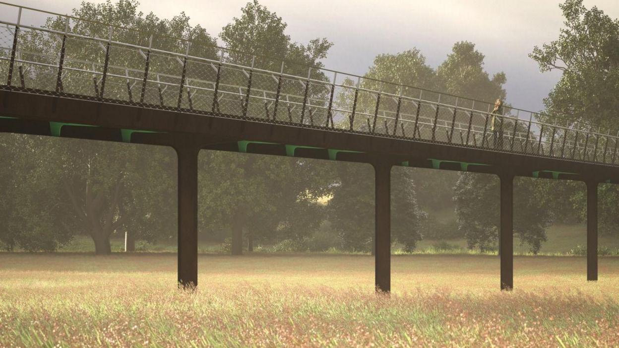 A computer generated image of the Hampton bridge in the middle of a field with trees surrounding the area.