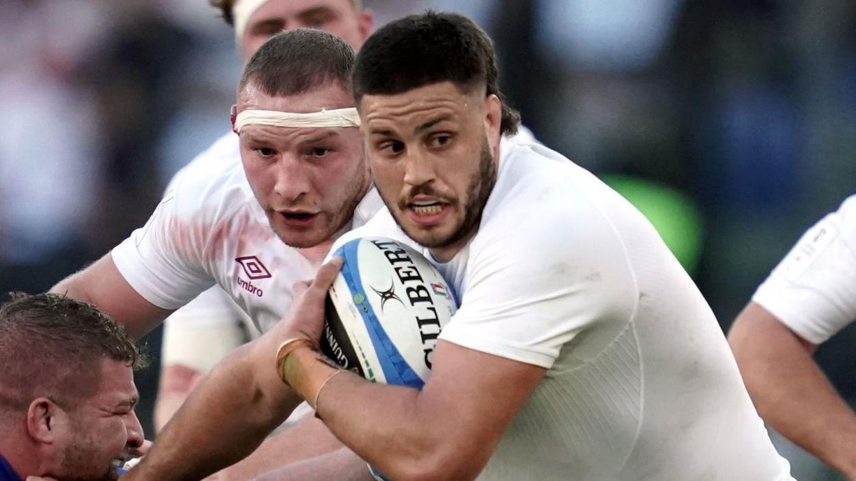 Ethan Roots carrying the ball for England