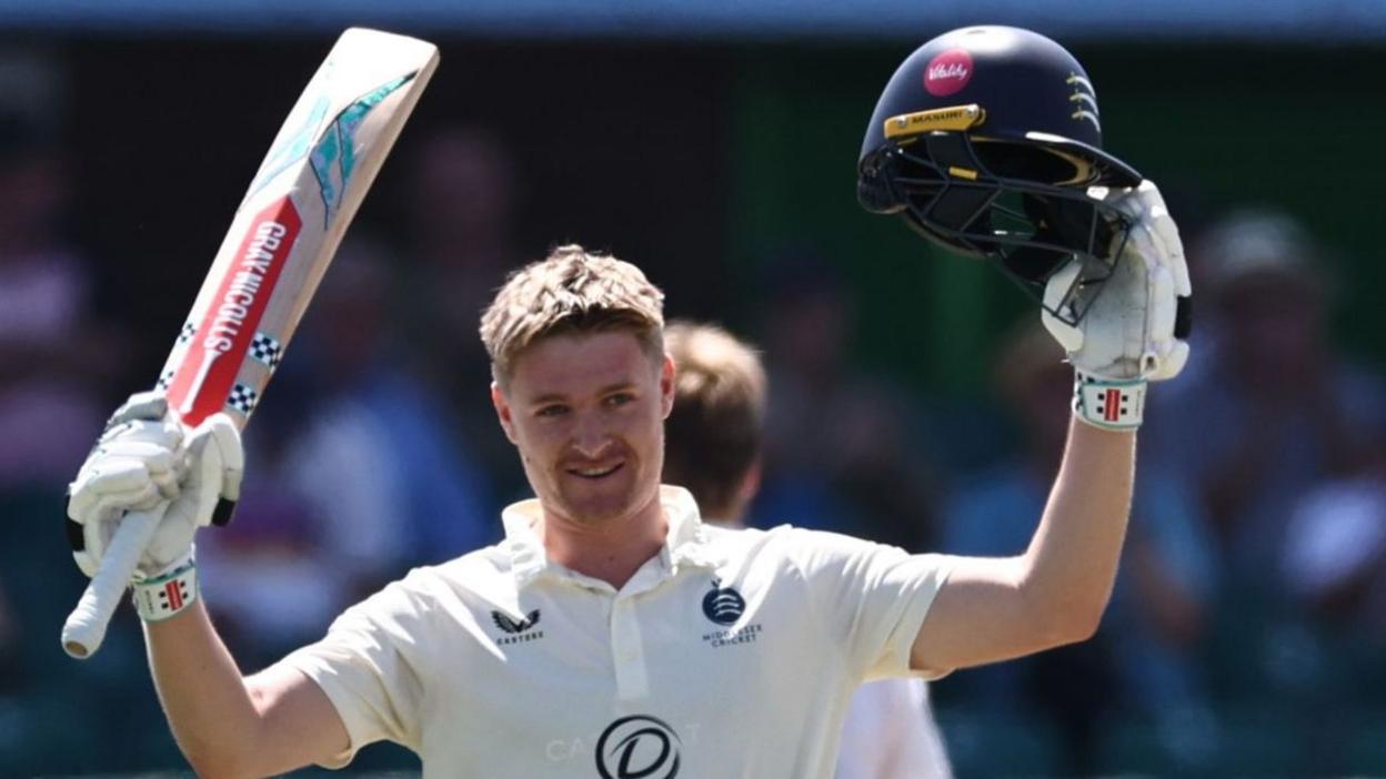 Middlesex batter Ben Geddes celebrates scoring a century