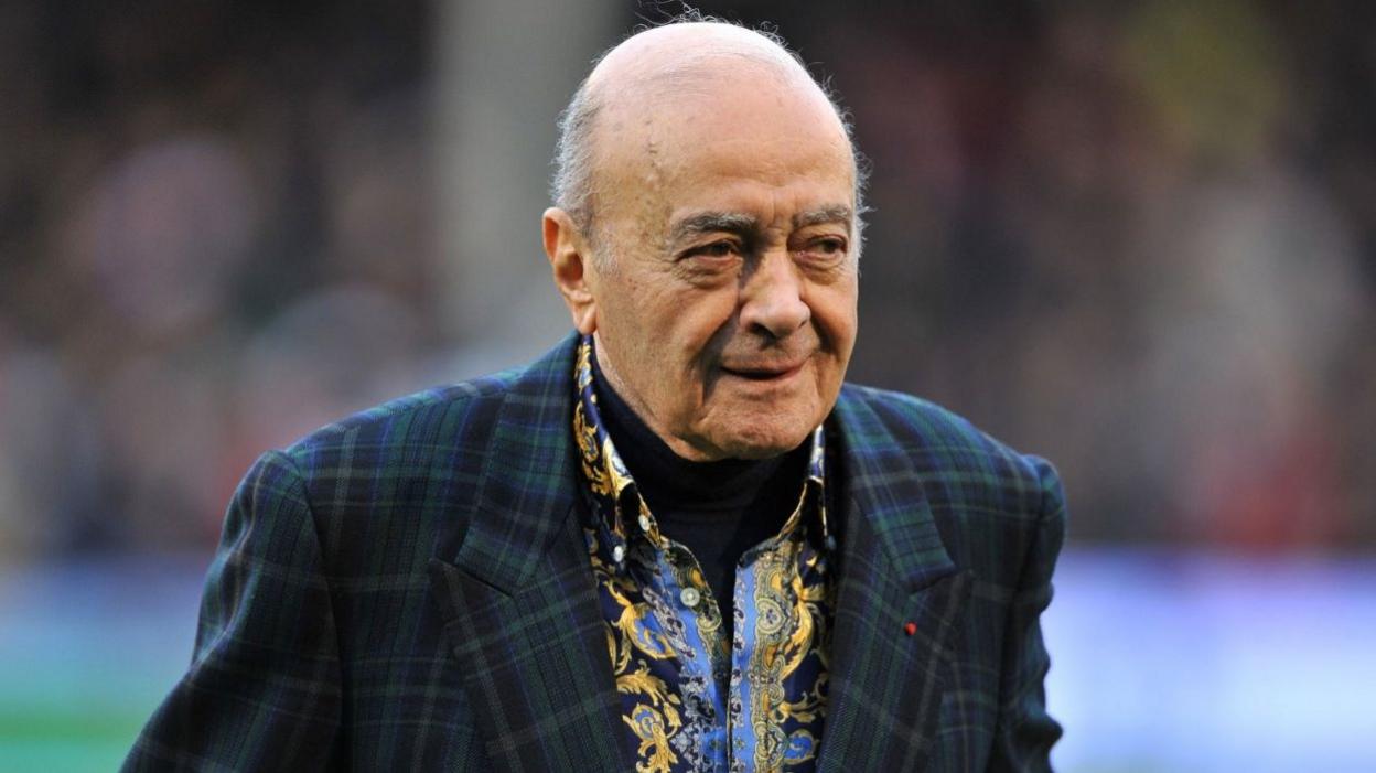 Al Fayed wearing a green blazer