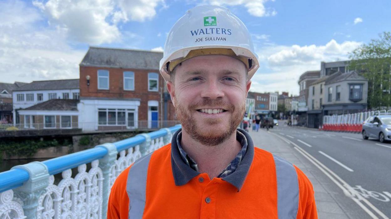 Joe Sullivan in a high-vis jacket standing on the bridge