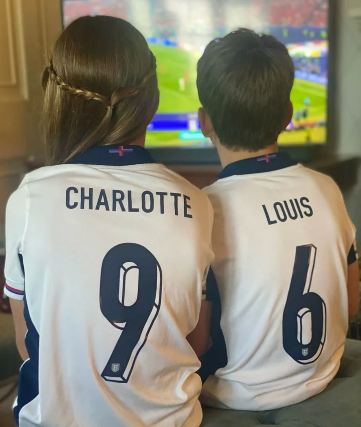 Princess Charlotte and Prince Louie watching an England football game