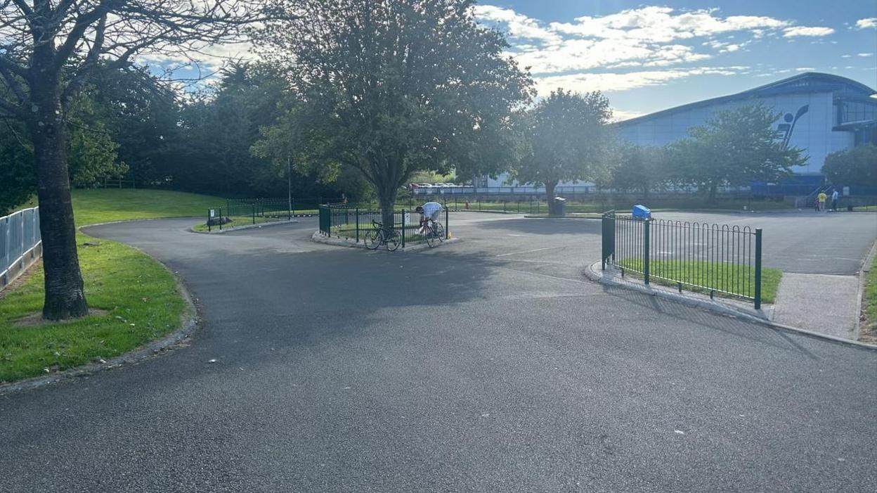 A tarmac raceway at the NSC, with the while and blue NSC building in the background.