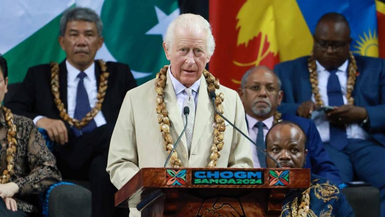 King Charles speaking from a podium as he opens the Commonwealth Heads of Government meeting. 