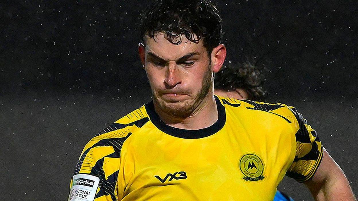 Will Tizzard in action for Torquay