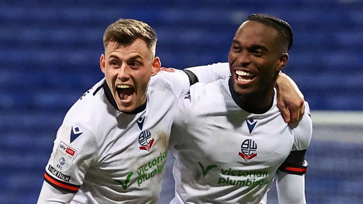 Bolton Wanderers' Jay Matete celebrates scoring his side's second goal with Szabolcs Schon