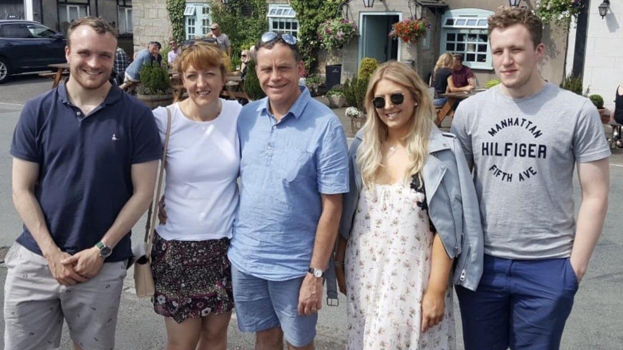 Anthony Lane (far right) with his father Paul Lane (centre) and family