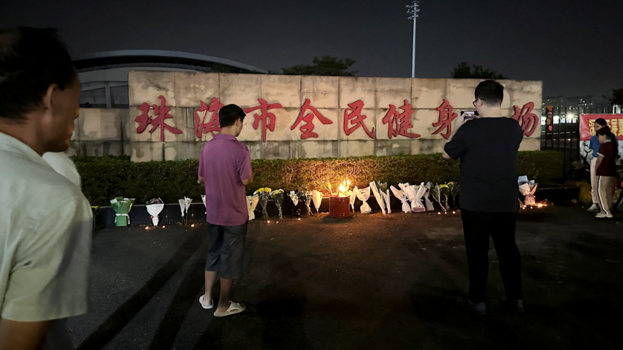 Mourners paying tribute to the victims outside the Zhuhai Sports Center on Tuesday 12/11/24.