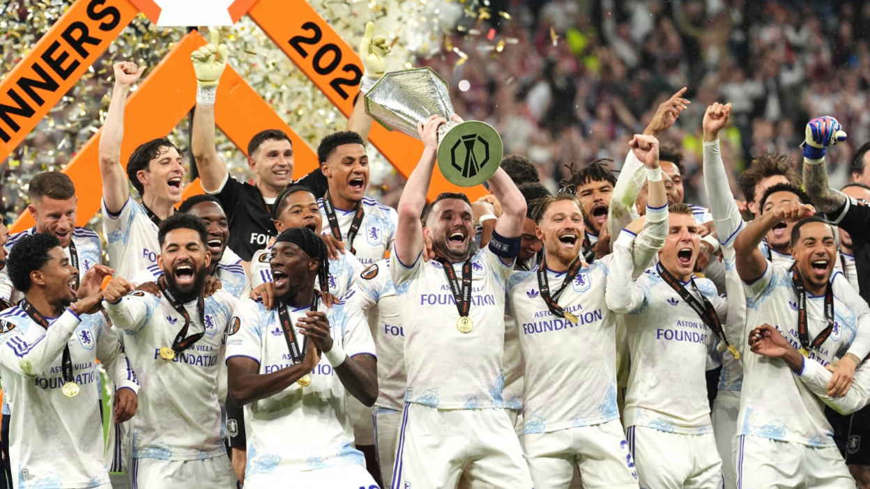 Aston Villa's John McGinn (centre) lifts the trophy with team-mates after winning the UEFA Europa League final at Besiktas Park, Istanbul.