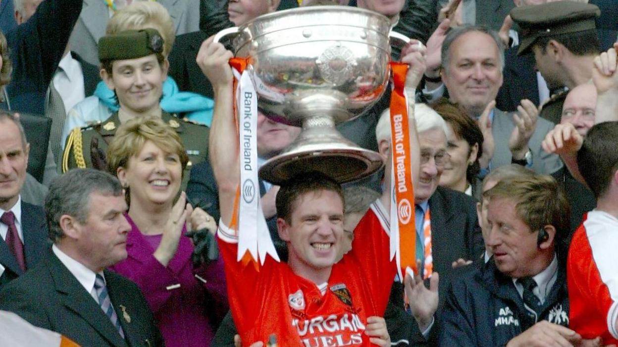 Kieran McGeeney lifts Sam Maguire in 2002