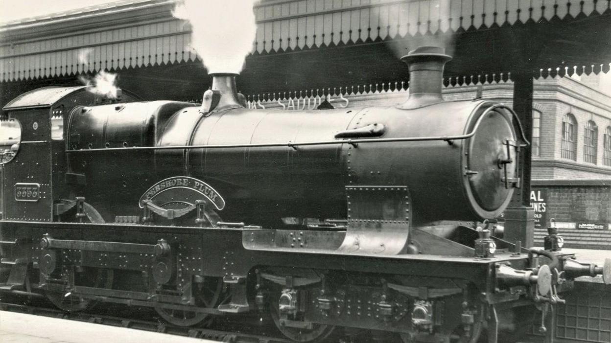 A black and white photo of the Pershore Plum locomotive, which stands at the sidings of Birmingham Snow Hill.