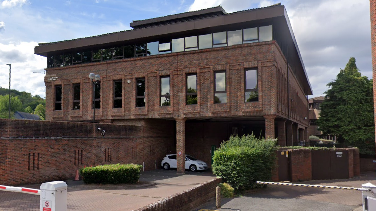 A Google Streetview look at Albert House in High Wycombe. A triple-storey brown bricked building with large windows. 