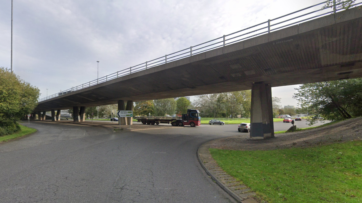 The Gateshead flyover from a roundabout. A lorry is just pulling out.   