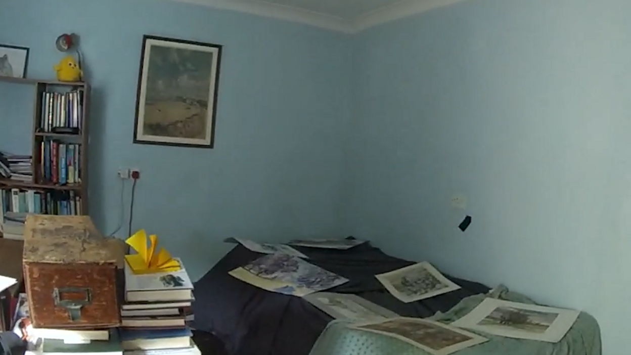 The rear room on the ground floor of the McCullough family home. In the right corner is where John McCullough's body was hidden. It is stashed beneath blankets and paintings.