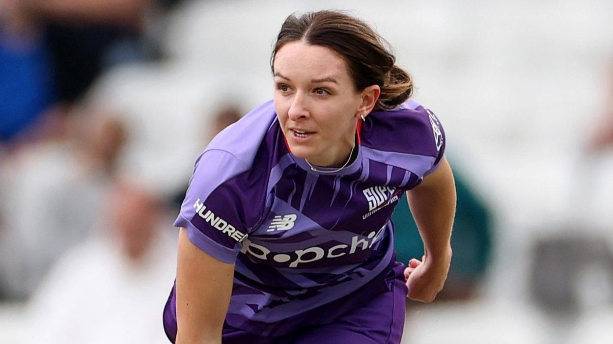 Kate Cross bowls in the purple of Northern Superchargers