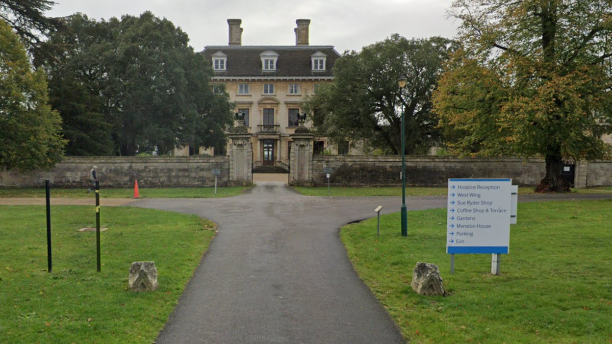 Thorpe Hall Hospice- historic building with a concrete driveway leading up to the big house 