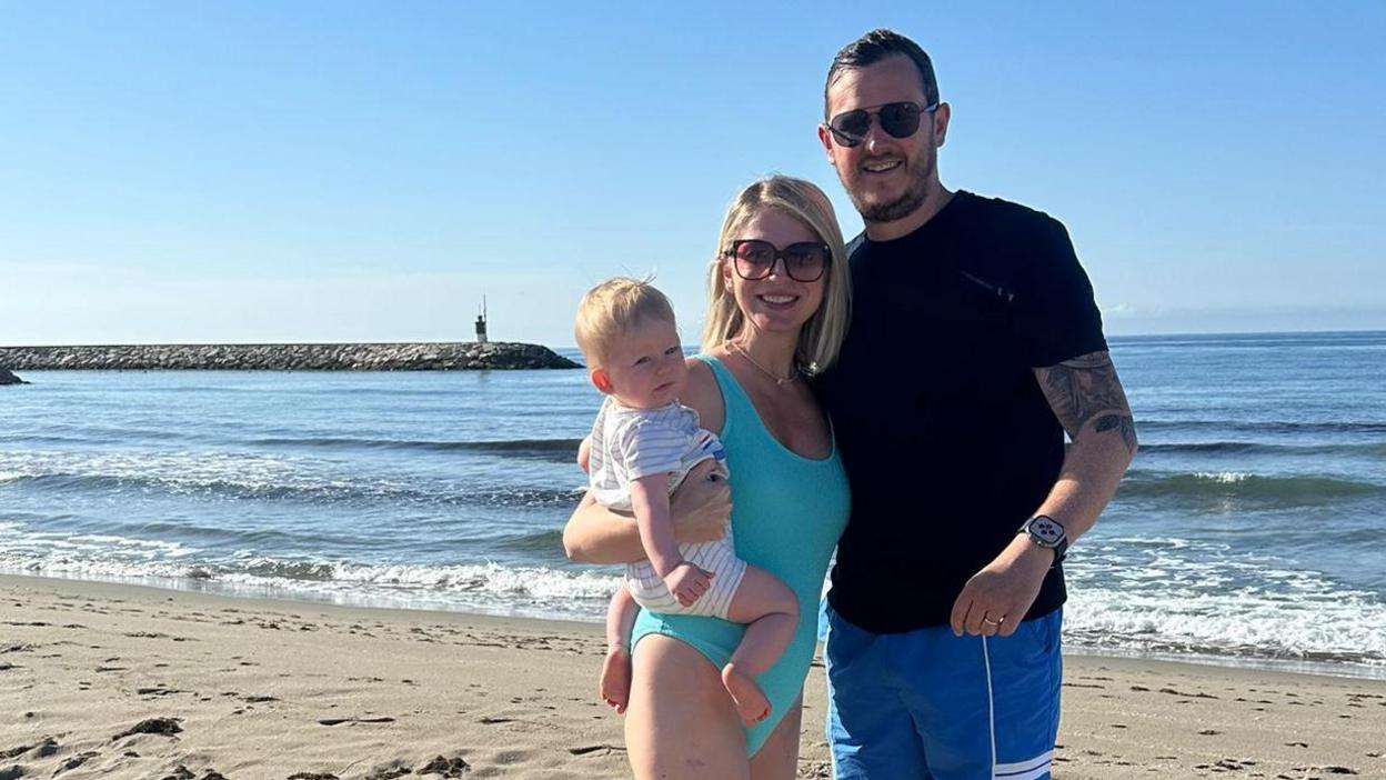 Nick, Amy and Freddie on the beach