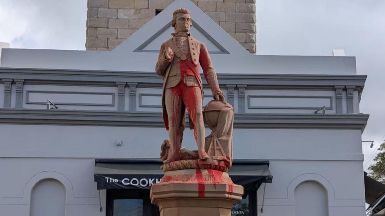 Paint covers the statue of Captain Cook