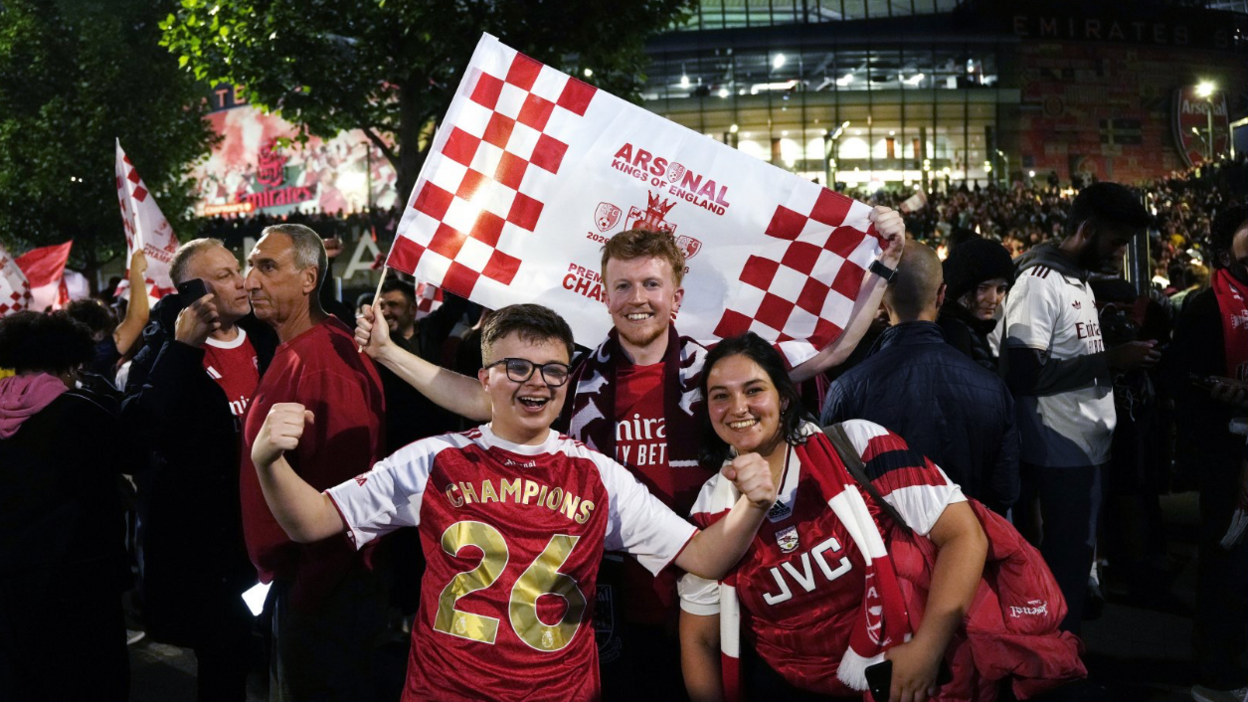 Arsenal fans celebrate at the Emirates Stadium, London.