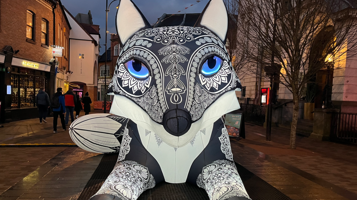 Illuminated fox at city lights event