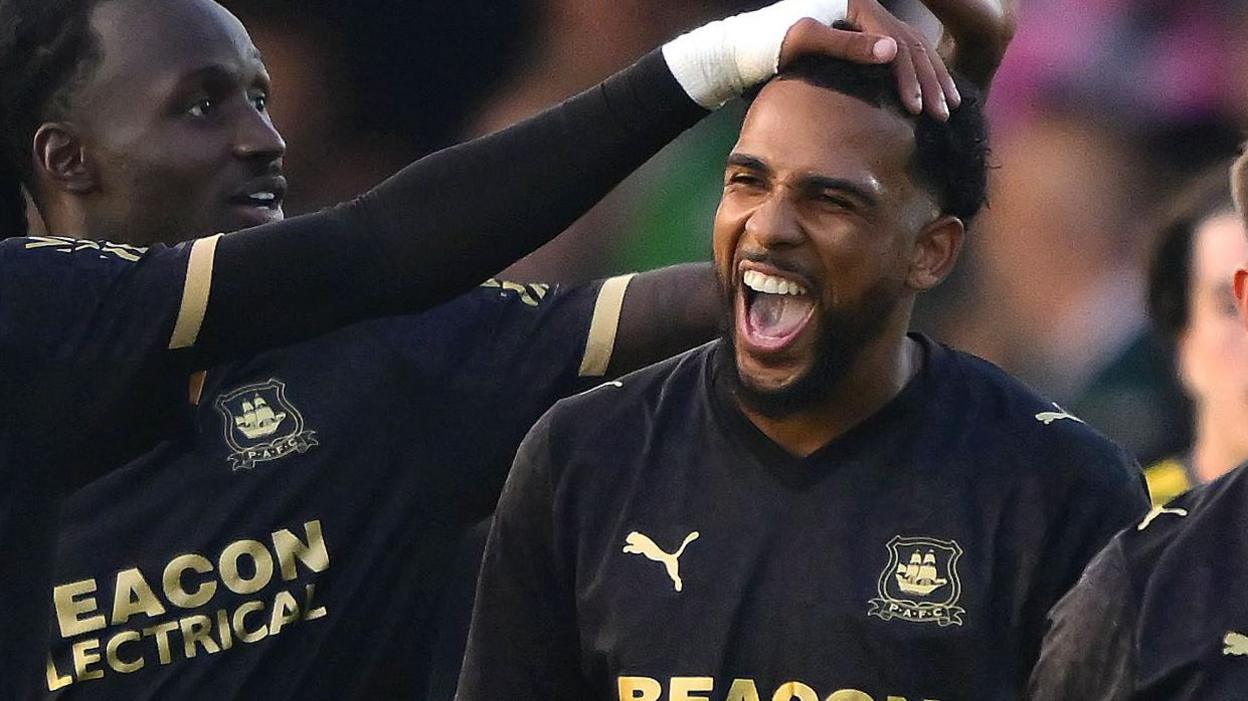Xavier Amaechi celebrates