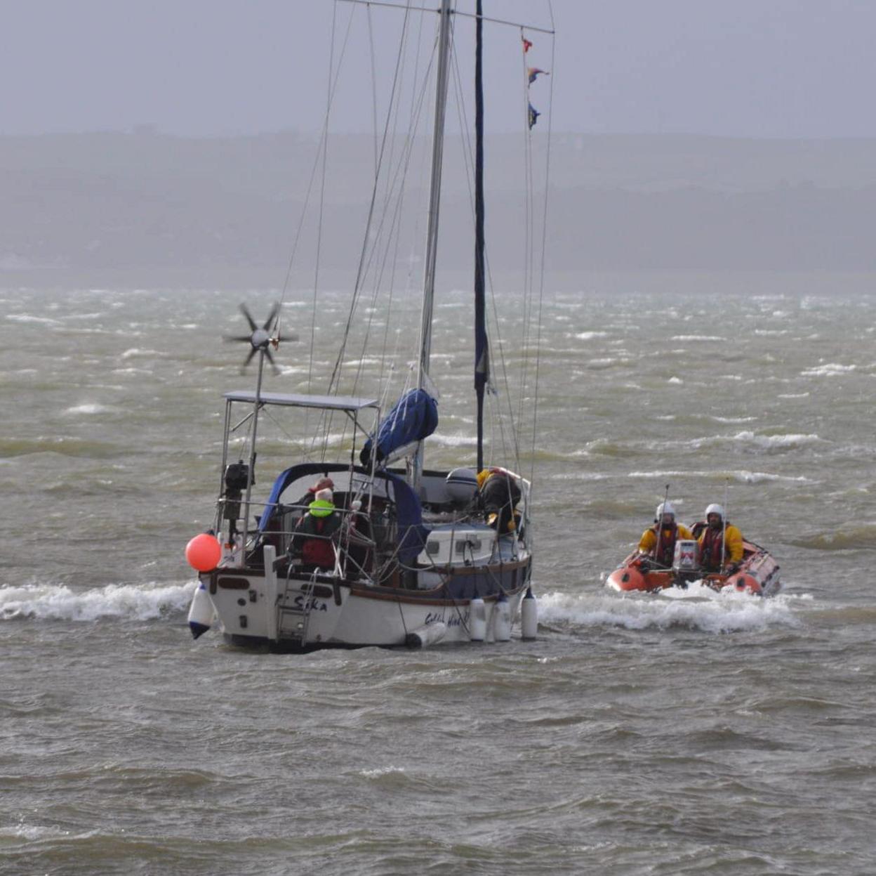 Boat being towed to shore