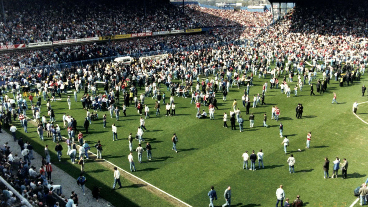 A photograph from the Hillsborough disaster of 1989 shows fans on the pitch