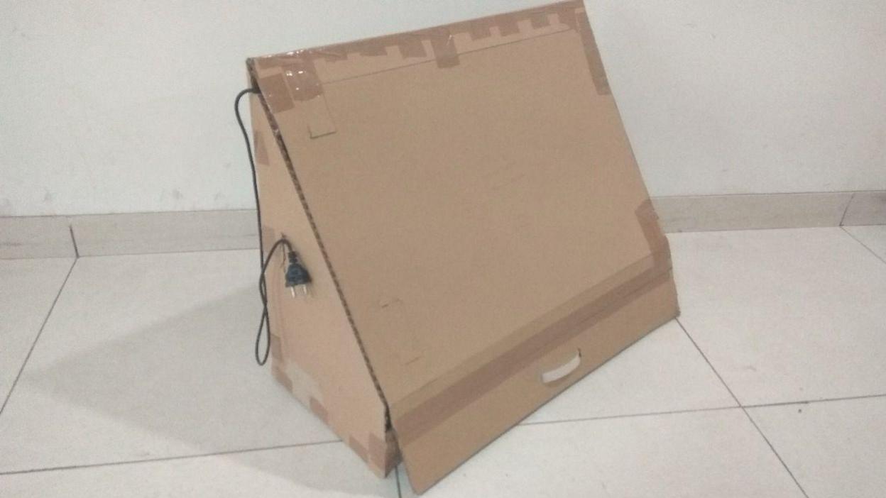 Prototype of a two-pair shoe rack fitted with a UVC tube light to kill odour-causing bacteria