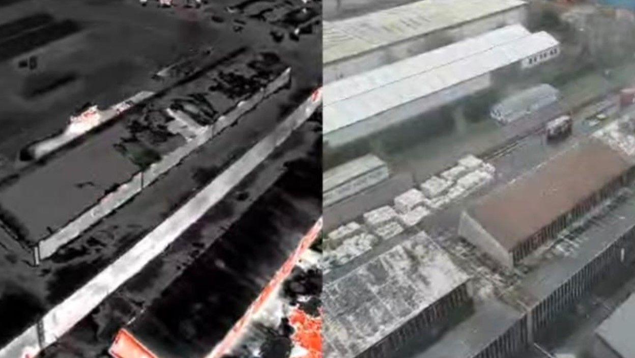 Drone footage showing the top of the premises, in which the roofs of multiple units are revealed. The image is a composite of two photos - one revealing the site as it appeared to firefighters in infrared and the other using regular photography